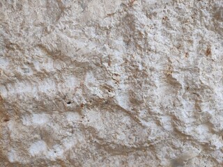 brown cream stone wall texture which is usually installed on the walls of houses or luxury villas