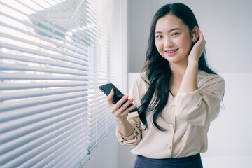 Asian woman smiling with arms crossed. Modern business asian woman