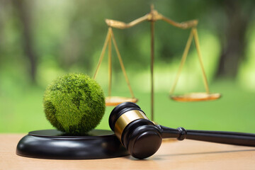 Environment Law. Green World and gavel with scales of justice on the green. law for principles of...