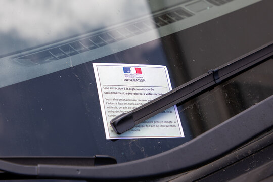 information parking ticket text sign by policeman French police for car violation of parking regulations