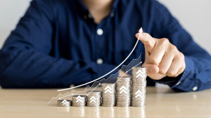 Businessman draws up arrow graph corporate for planning businesses. Concept for invest, finance and business strategy