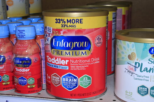 Enfagrow Baby formula in containers on a shelf at a supermarket