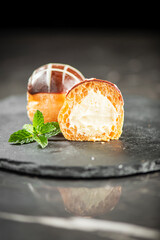 Delicate gluten free choux pastry ball filled with Bavarian patisserie cream.