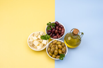 Varieties of pickled olives, Halloumi cheese with herbs and a bottle of extra virgin olive oil as a traditional Cypriot export concept