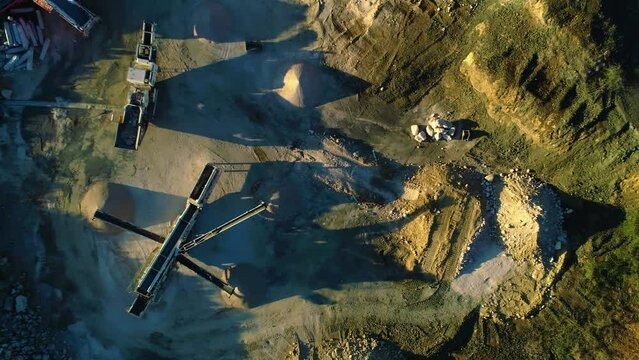 Linear overpile portal reclaiming dirt machine chutes spread piles, top down side to side drone aerial
