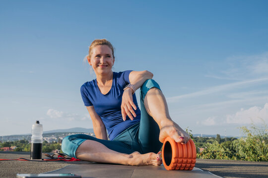 Mature woman taking break on rooftop