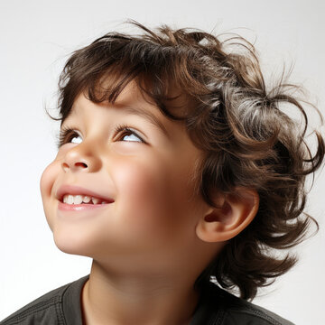 A professional studio headshot capturing the whimsical daydreams of a 5-year-old Lebanese boy.