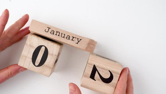 January 1st. Day 1 of month, calendar on wooden background. Winter time, New year concept