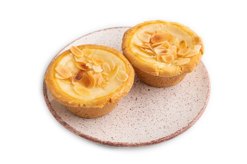 Traditional portuguese cakes pasteis de nata, custard small pies isolated on white. Side view.