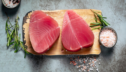 Raw Tuna fish steaks on vintage background flat lay. Healthy cooking. Food concept. Top view