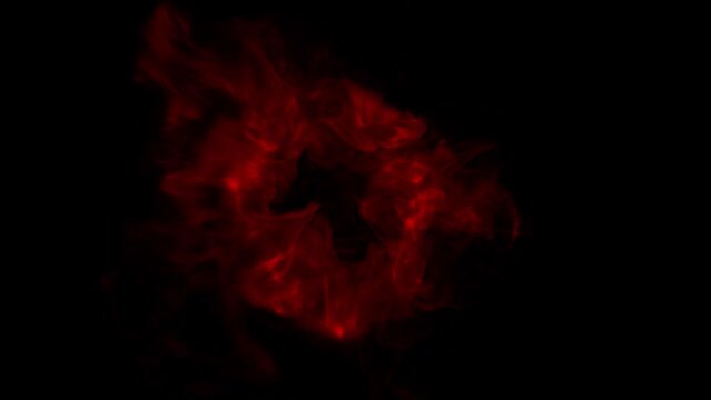 Explore the intensity of 4K footage showcasing a red halo against a dramatic black background. Immerse yourself in the abstract explosion footage, revealing a mesmerizing red flame explosion