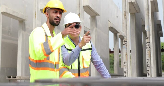 building and construction worker, Hiapanic latin and asian male in safety hard hat helmet working on steel wire mesh for concrete slab reinforcement at Prefabricated concrete walls Manufacturing
