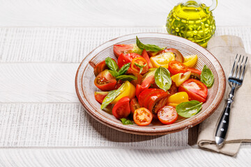 Tomato salad with fresh basil and olive oil