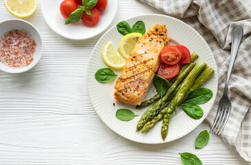 Baked Delicious salmon, green asparagus on  plate