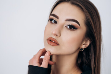 Fototapeta premium Close up fashion portrait of young pretty indian latin american woman posing in photo studio on white background. Hispanic lady, skin care, solarium, make up, cosmetology 