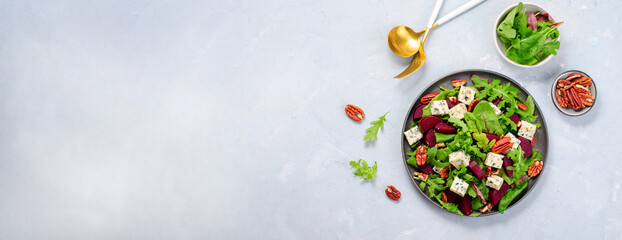 Beetroot Salad with Blue Cheese, Nuts and Salad Mix over Bright Background