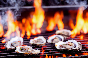 oysters on grill with fire