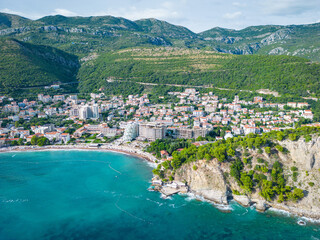 Petrovac na Moru Aerial View. Beaches and coastline of the Adriatic Sea at summer time. Natural landscapes of Montenegro. Balkans. Europe.