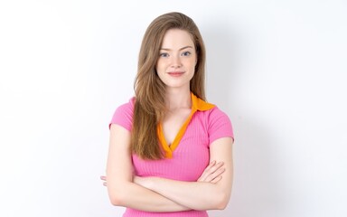Fototapeta premium Dreamy rest relaxed Young woman wearing pink dress crossing arms,