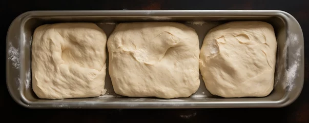 Foto op Plexiglas Raw bread dough shaped and placed in a bread pan. Generative AI. © Simona