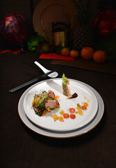 smoked peking duck slice with fresh vegetables salad appetiser fine dining cuisine halal food banquet restaurant menu on dark background