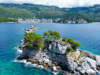 Church on the rock on Katic islet in Petrovac na Moru Aerial View. Beaches and coastline of the...