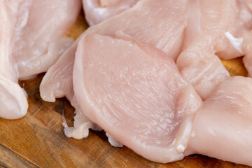 fresh and raw chicken meat during cooking