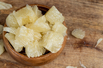 peeled pomelo on the table, close up