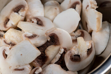 sliced mushrooms during cooking dishes with champignons