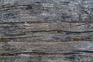 Wooden covering of the old  narrow footbridge in overcast weather