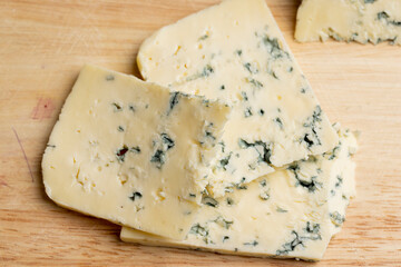 Cheese with blue mold cut into pieces