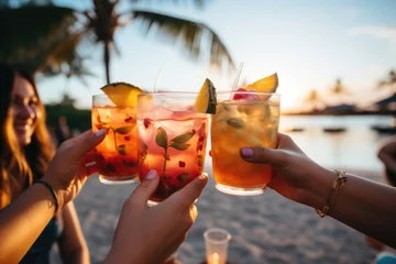 Foto op Plexiglas Friends toasting with tropical drinks on a sunny beach  - stock photography concepts © 4kclips