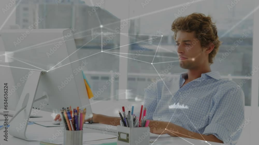 Aufkleber animation of connected dots and graph icons over caucasian man working on desktop in office