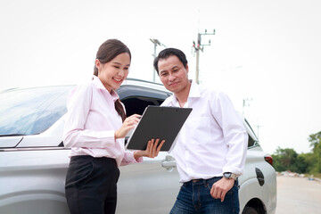 Car insurance agent holding a car accident claim process document form for a client. Transport...