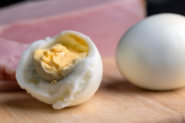 Boiled chicken egg with sliced pieces of meat