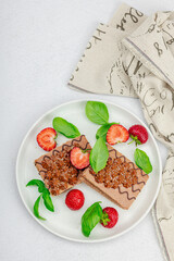 Delicious chocolate cakes with fresh strawberries. Sweet dessert, good morning concept