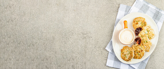 Hake fillet fried in batter. Sauce, fresh rosemary, dry lemon slices. Vegetarian food concept