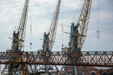 Large metal construction cranes at the docks