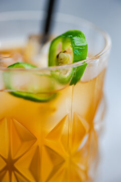 Close-up of a cocktail with jalapeno peppers