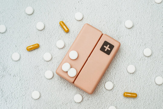 Overhead view of assorted pills on a pill box