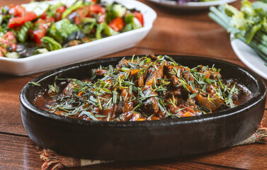Tzhvzhik - Armenian dish from beef or chicken liver, heart and stomachs with onions and spices  in a bowl on the table. Armenian ,coucasian cuisine