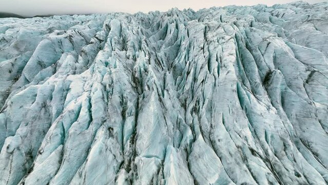Aerial view of white glacier. Epic Drone Shot iceberg in national park in Iceland.