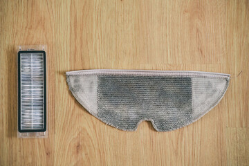 Mop and HEPA dust filter replacement for robot vacuum cleaner. Duster spare parts replace. Modern housekeeping accessories concept.