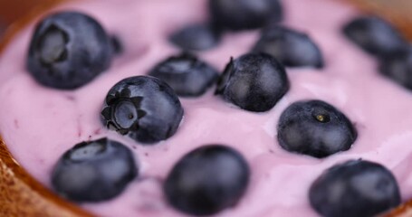 blueberry yogurt with the addition of ripe blueberries, delicious and fresh natural yogurt with the taste and berries of blueberries - Powered by Adobe