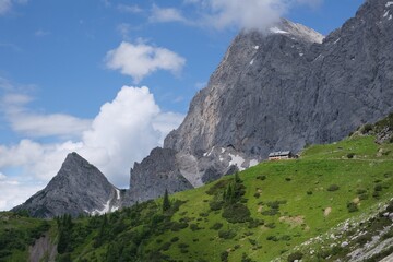 Beautiful mountain views with mountain hut on tourist trail from Turlwand to Oberhofalm. Trekking...