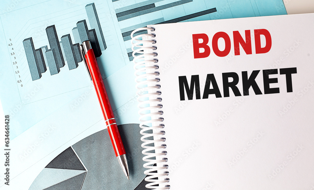 Poster bond market text on a notebook with pen on a chart background