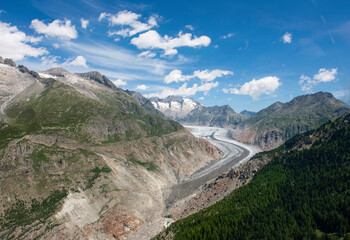 Glacier in Swiss Alps in summer showing how much the glacier has receded over recent years