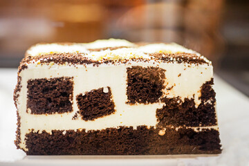 fresh slice of chocolate white cake on display. homemade baking