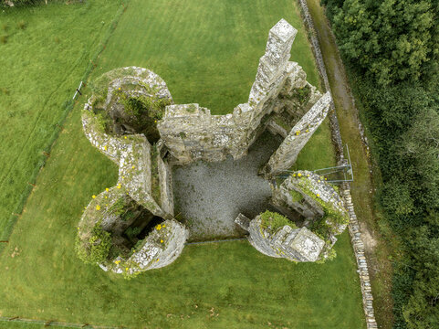 Aerial view of Ballinafad Castle, also known as the Castle of the Curlew, small central block dwarfed by four massive corner towers near Lough Arrow in Ireland