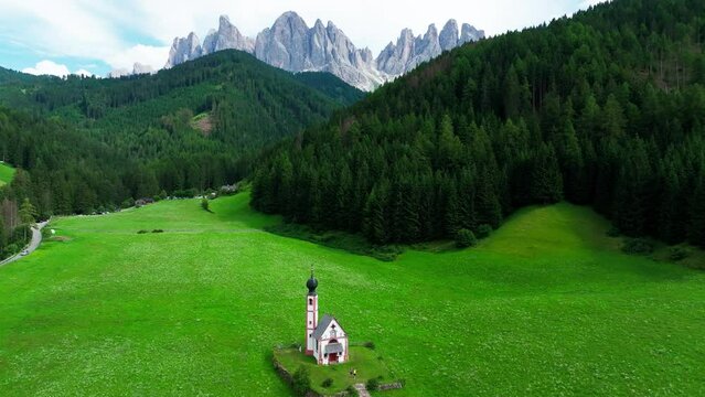 Church of St. Johann with The Dolomites mountains in the background in Val Di Funes valley, Trentino Alto Adige region, Italy, Europe.